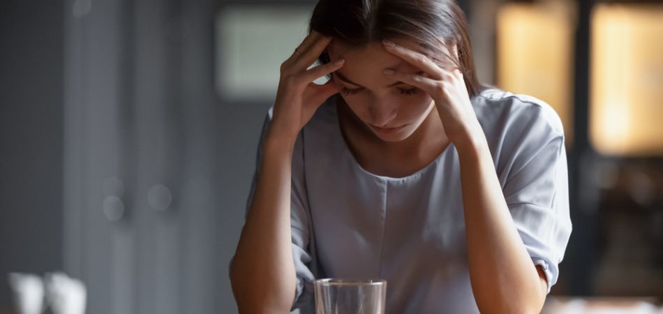 Woman drinking alcohol with depression