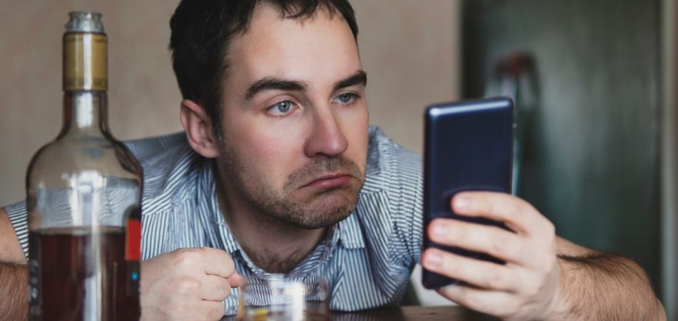 alcoholic man with phone